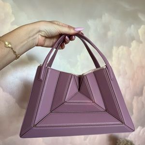 Mlouye leather hand bag. 100% authentic in perfect condition. Limited edition